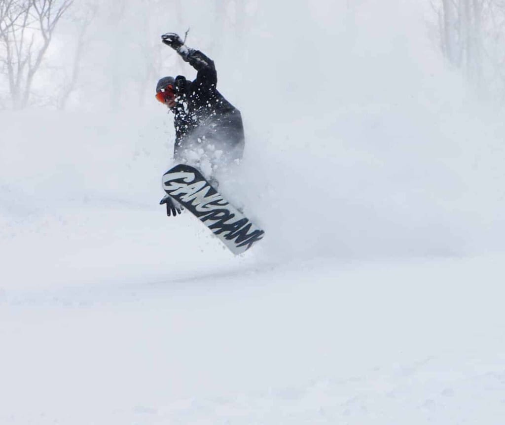 A snowboarder in fresh snow
